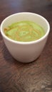 Macha latte in a white mug