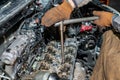 Machanic repairman at the cylinder head servicing. Royalty Free Stock Photo