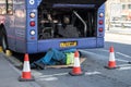 Machanic working on a broken down First Group bus with engine visible