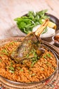 Machboos Laham biryani with lamb chop served in dish isolated on table top view of arab food