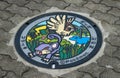 Pokemon manhole cover in Serigaya park in Machida showing the characters `Rattata` and `Pidgey`