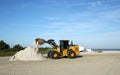 Machine cleans up dead fish on Fort Myers Beach. Royalty Free Stock Photo