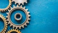 Machine cogs on a blue background. Royalty Free Stock Photo