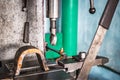 A close-up view of a metal drilling machine operating in a workshop, showcasing precision and craftsmanship in action Royalty Free Stock Photo