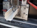 Machine for forming aluminum gutters Rain Gutter continuous manufacture of aluminum roll in workshop van Royalty Free Stock Photo