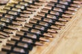 Machine gun ammo on a wooden table, bullet belt, bandoleer, chain of ammo on wooden background,cartridge 7.62 mm caliber Royalty Free Stock Photo