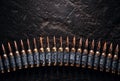 Machine gun bullet belt on the floor. Background on the military theme. Ammo, chain of ammo on concrete background. Top Royalty Free Stock Photo