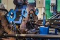 Machine for induction heating of metal. A metal rod heated in an induction furnace. Hot metal processing. Metalworking in the Royalty Free Stock Photo