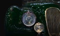 Vintage green car headlight close-up