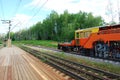 A machine for laying rails and sleepers. Rail-laying machine. Railway construction. Rails, sleepers. Laying of railway Royalty Free Stock Photo