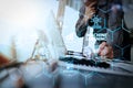 businessman hand working with new modern computer and smart phone and business strategy document on wooden desk with calculator Royalty Free Stock Photo