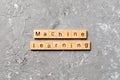 Machine learning word written on wood block. Machine learning text on cement table for your desing, concept Royalty Free Stock Photo