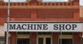 Machine Shop Sign on Historic Building in Downtown Granger TX Royalty Free Stock Photo