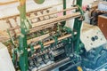 Machine for stitching sheets of paper in the printing. Magazine, brochure, book. Production of printed products. Vintage Royalty Free Stock Photo