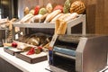 Machine for toasting bread - toaster, a variety of baguettes and Royalty Free Stock Photo