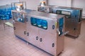 Machine for washing and disinfecting plastic bottles at factory for production of purified drinking water