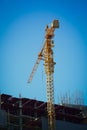 Machinery crane working in construction site building Royalty Free Stock Photo