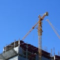 Machinery crane working in construction site building Royalty Free Stock Photo