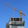 Machinery crane working in construction site building Royalty Free Stock Photo