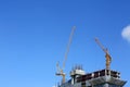 Machinery crane working in construction site building Royalty Free Stock Photo