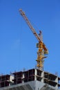 Machinery crane working in construction site building Royalty Free Stock Photo