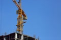 Machinery crane working in construction site building Royalty Free Stock Photo