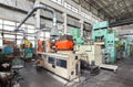 Machinery plant. Workshop for production of thermoplastic parts. Injection molding plastic machine and hydraulic press Royalty Free Stock Photo