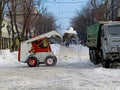 Machinery snowblower. Natural disasters winter, blizzard, heavy snow paralyzed the city, collapse. Snow covered the cyclone Europe