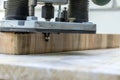 Machining with an electric wood plank router, hand-held router close-up. Selective focus Royalty Free Stock Photo