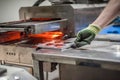 Machinist technician operating with automatic heater stove heating PVC machine Royalty Free Stock Photo