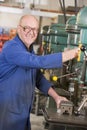 Machinist working on machine