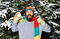Macho with beard and mustache holds snowball and thumb up Royalty Free Stock Photo
