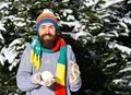 Macho with beard and mustache makes snowball Royalty Free Stock Photo