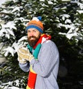 Macho with beard and mustache makes snowball. Royalty Free Stock Photo