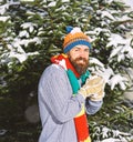 Macho with beard and mustache makes snowball. Royalty Free Stock Photo