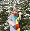 Macho with beard and mustache throws snowball. Royalty Free Stock Photo
