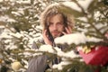 Macho with bearded face in snow forest