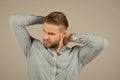 Macho in blue fashionable shirt, fashion. Man with bearded face and blond hair, haircut. Mens fashion style and trend Royalty Free Stock Photo