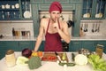 Macho in chef hat, apron put finger on lips in kitchen Royalty Free Stock Photo