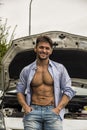 Macho handsome man leaning against his car Royalty Free Stock Photo