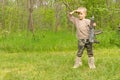 Macho little boy playing with a gun Royalty Free Stock Photo