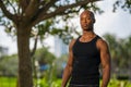 Macho man posing in a tank top shirt Royalty Free Stock Photo