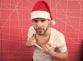 Macho in red xmas hat on pink background Royalty Free Stock Photo