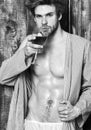 Macho tousled hair degustate luxury wine. Drink wine and relax. Guy attractive relaxing with alcohol drink. Man sexy Royalty Free Stock Photo