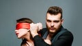 Macho well groomed confident hipster and sexy woman tied hands red ribbon. Sexual relations. Sex game. Tease and seduce Royalty Free Stock Photo