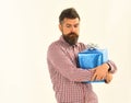 Macho with wrapped blue gift and white bow Royalty Free Stock Photo