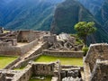 A suggestive panoramic view from above of the ancient Inca city of Machu Picchu and its characteristic stone houses Royalty Free Stock Photo