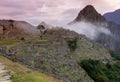 Machu Picchu, Cusco, Peru in the morning mist, found on the steep slopes of the Andes Mountains Royalty Free Stock Photo
