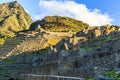 Machu Picchu green terraces and ruins with mountains in the back Royalty Free Stock Photo