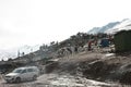 Machu Picchu, Peru, 3-21-2019: family business with horses surrounded by snow high in the andean mountains